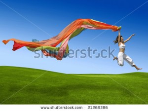 stock-photo-athletic-woman-jumping-on-a-green-meadow-21269386
