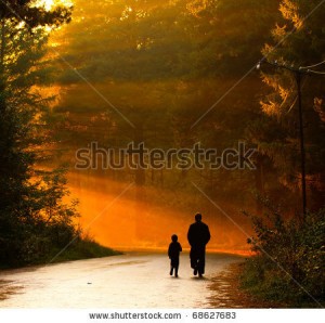 stock-photo-father-and-son-walking-in-the-sunlight-68627683