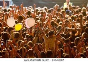 stock-photo-yellow-lighted-arded-crowd-at-a-live-concert-of-a-famous-rockband-80503267